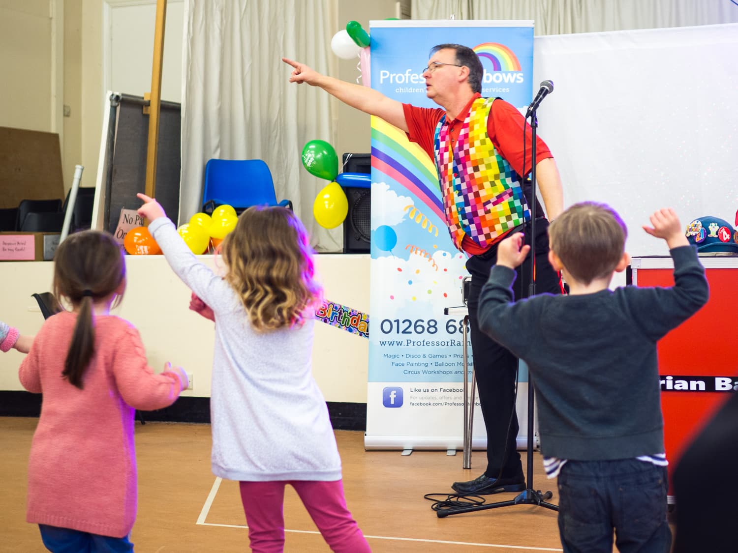An entertainer teaching kids to dance