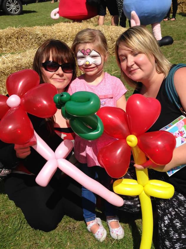 Enjoying balloons at a summer fete