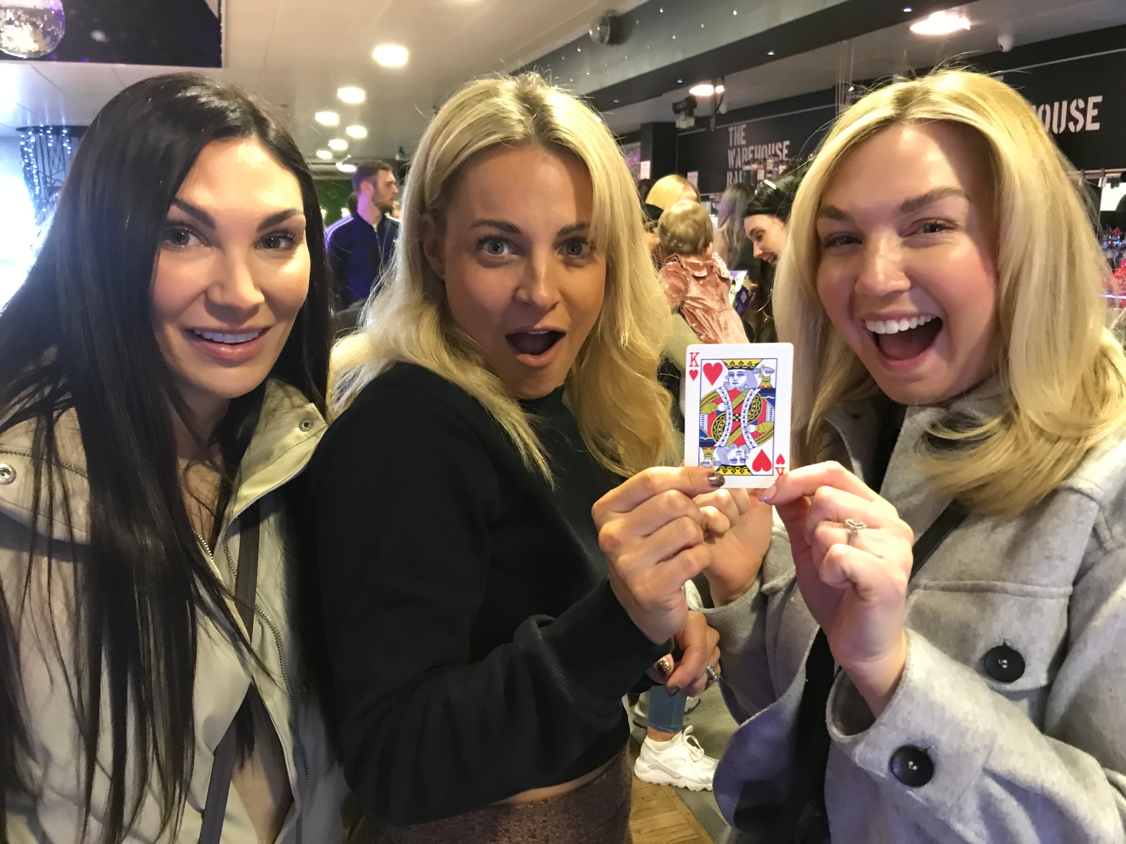 Three woman impressed my a card trick