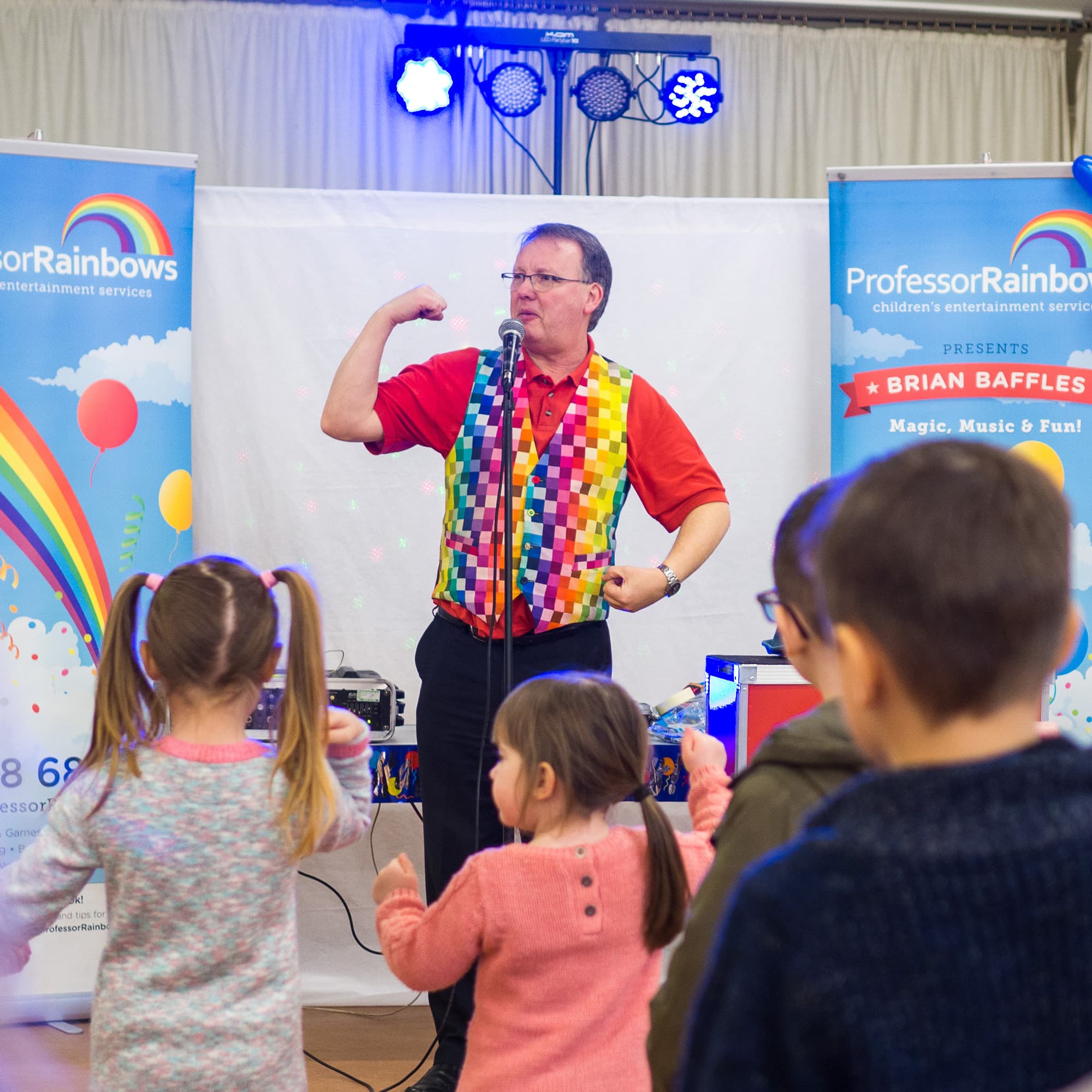 A children’s entertainer doing dance moves